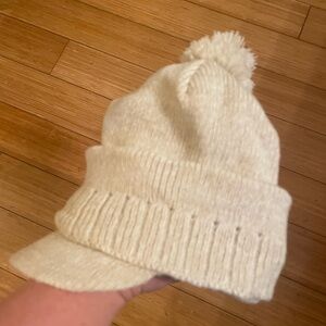 Winter knit hat with visor.  Light cream yarn. Very soft, never worn.